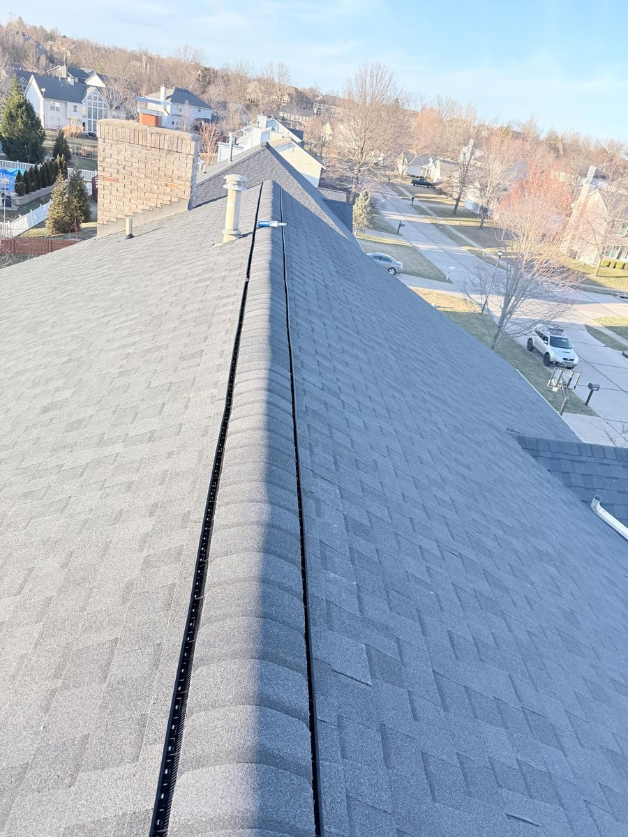 Premium roof replacement in St. Louis by AIO Pro Roofing — drone view of finished roof with architectural shingles