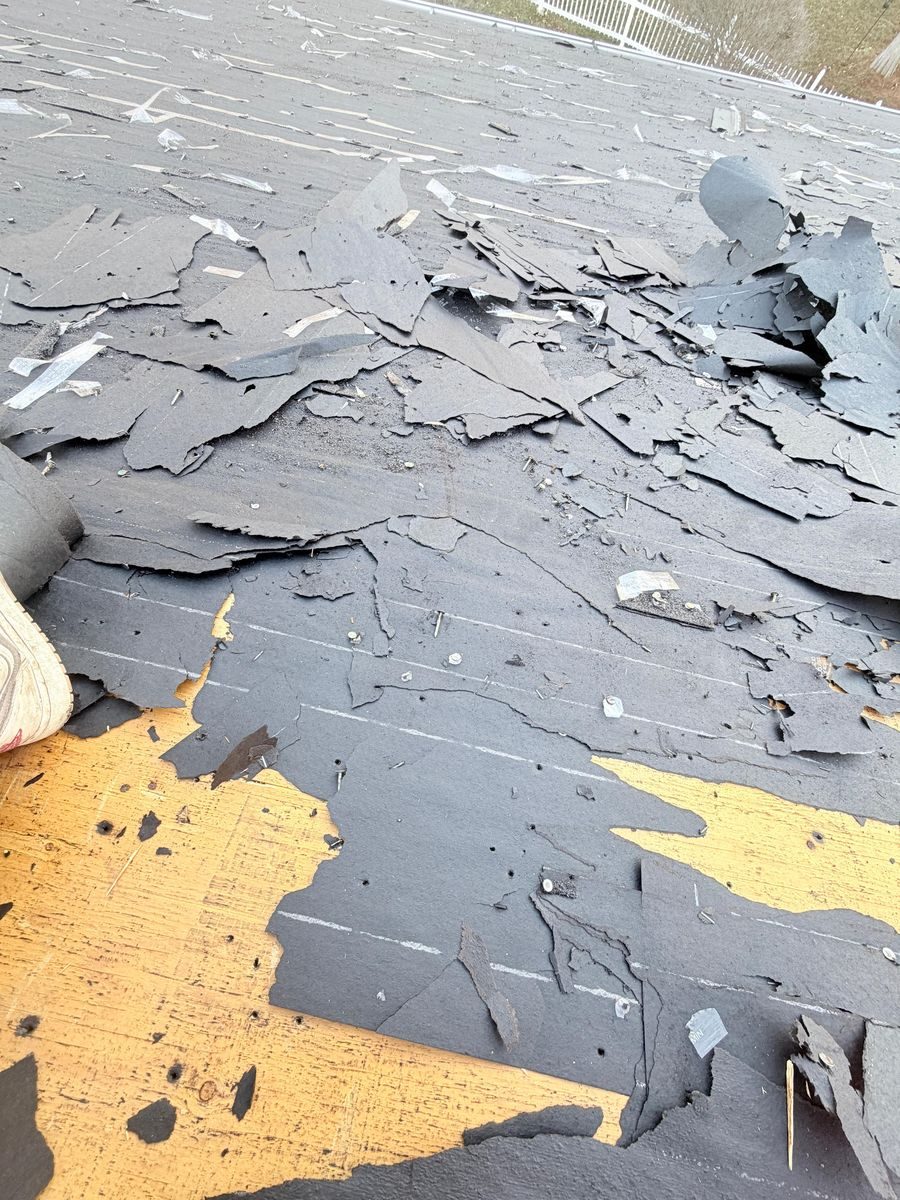 Storm-damaged roof before restoration